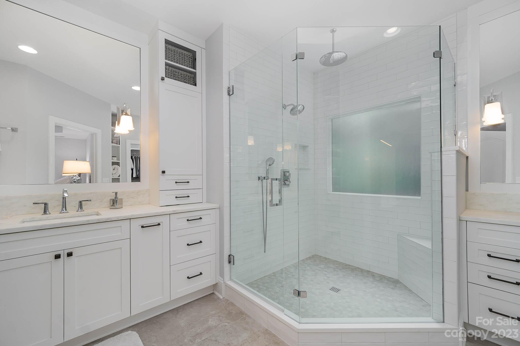 4922 Spur Ranch Road Charlotte, NC 28277 - Photo 14 of 33 a bathroom with a shower sink and mirror