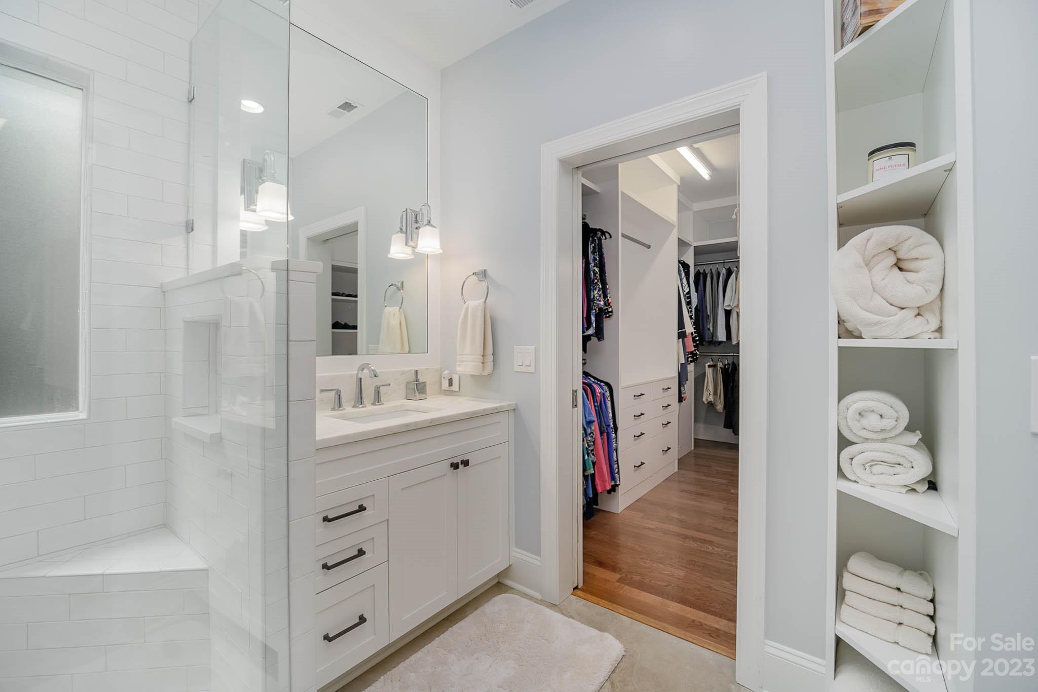 4922 Spur Ranch Road Charlotte, NC 28277 - Photo 15 of 33 a bathroom with a double vanity sink a mirror and shower