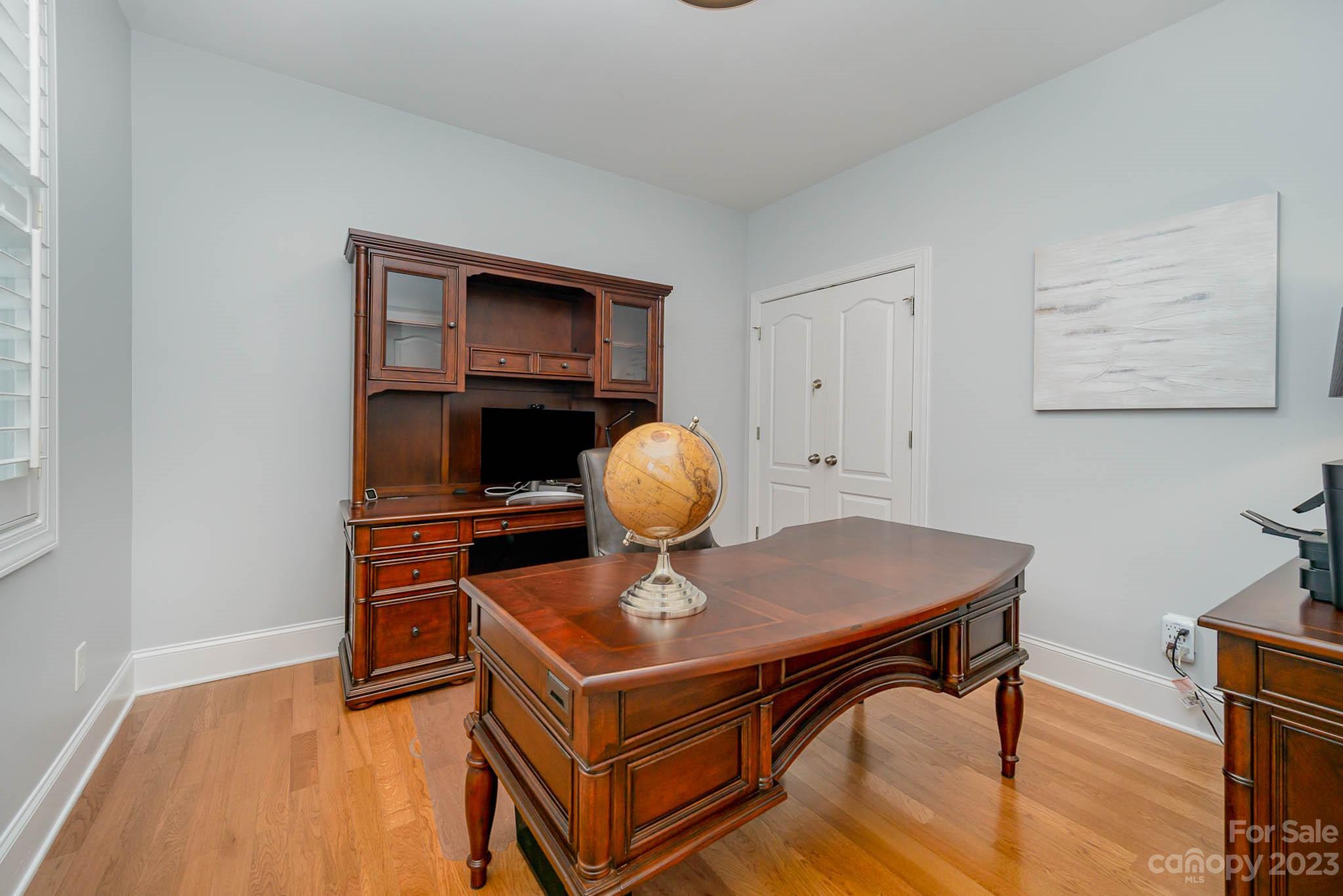 4922 Spur Ranch Road Charlotte, NC 28277 - Photo 19 of 33 a room with furniture and wooden floor