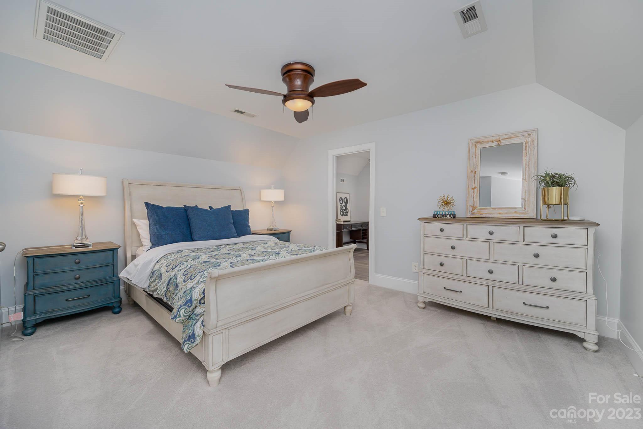 4922 Spur Ranch Road Charlotte, NC 28277 - Photo 26 of 33 a bedroom with a bed and a dresser