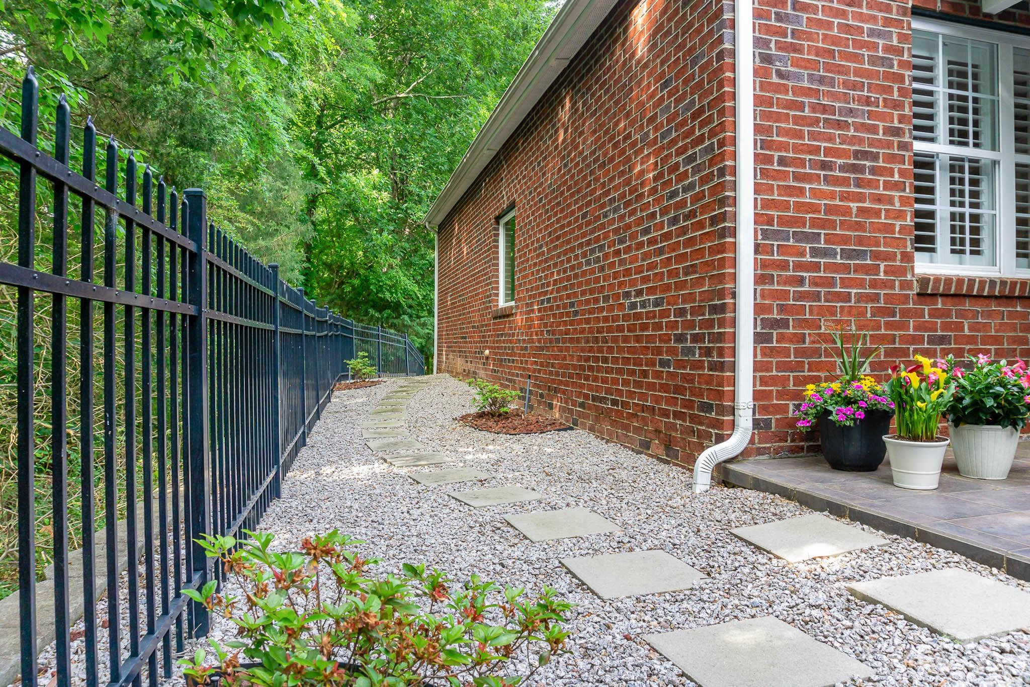 4922 Spur Ranch Road Charlotte, NC 28277 - Photo 30 of 33 a view of a backyard with potted plants