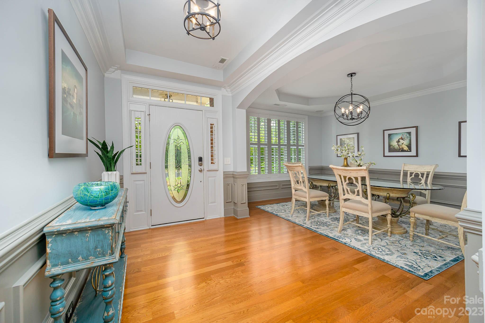 4922 Spur Ranch Road Charlotte, NC 28277 - Photo 3 of 33 a living room with furniture and a clock