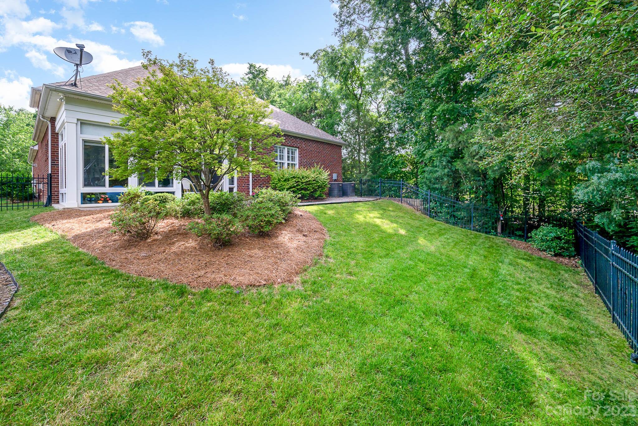 4922 Spur Ranch Road Charlotte, NC 28277 - Photo 32 of 33 a view of a house with a backyard