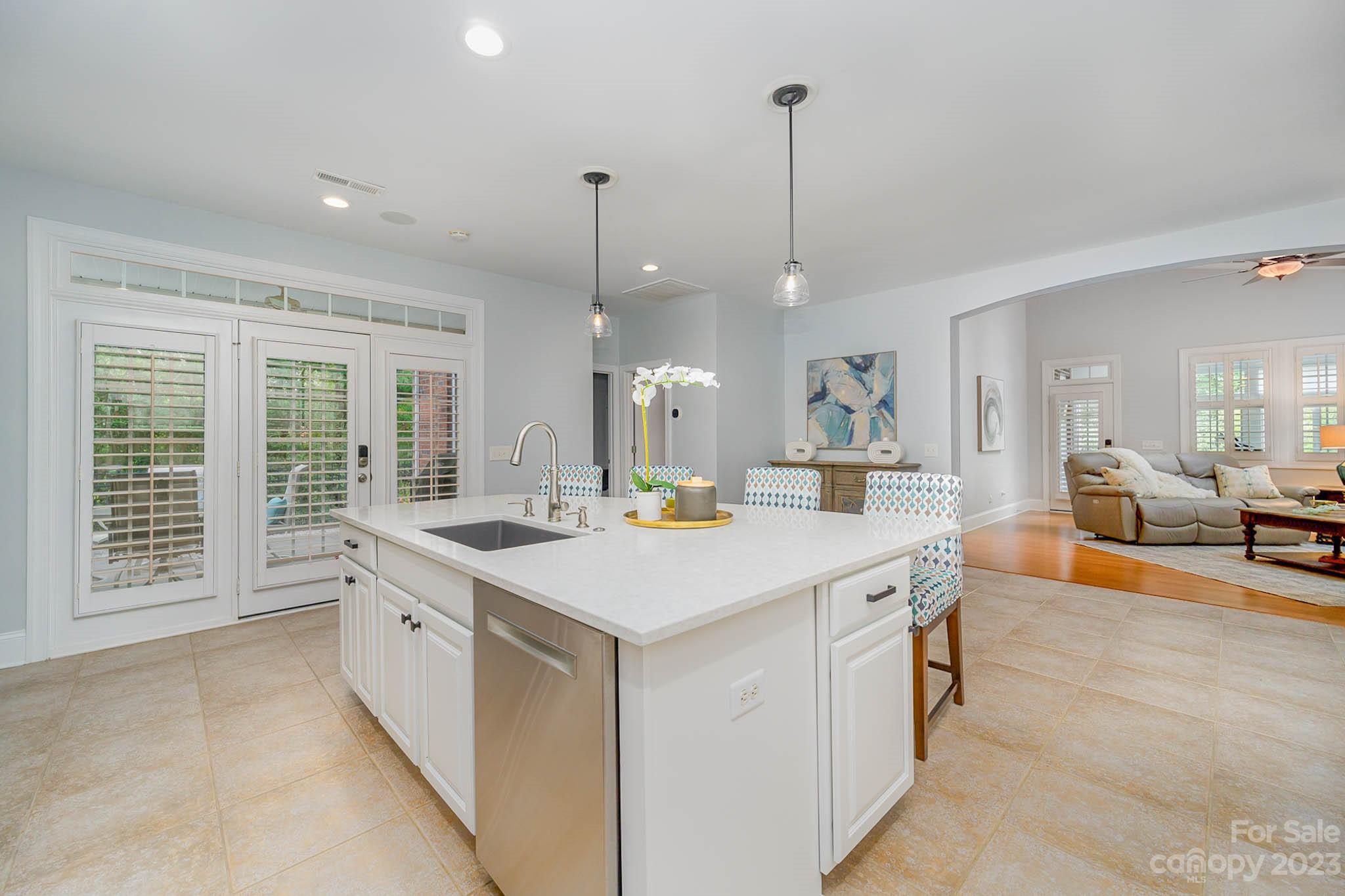 4922 Spur Ranch Road Charlotte, NC 28277 - Photo 7 of 33 a large kitchen with kitchen island a large island in it