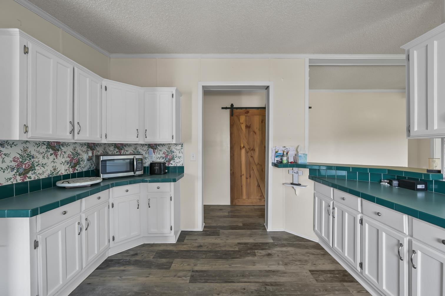 6439 Cedar Grove Road Big Sandy, TN 38221 - Photo 9 of 38 a kitchen with granite countertop white cabinets and sink