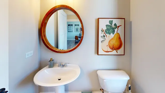 a bathroom with a toilet and a sink