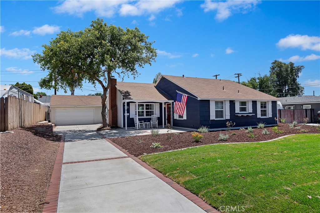 5656 Carson Road Riverside, CA 92506 - Photo 1 of 1 a front view of a house with a yard and garage