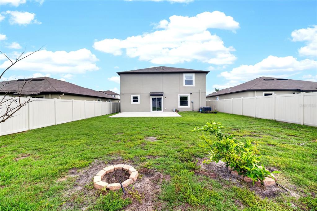 31724 Sun Kettle Loop Wesley Chapel, FL 33545 - Photo 44 of 49 a house view with a garden space