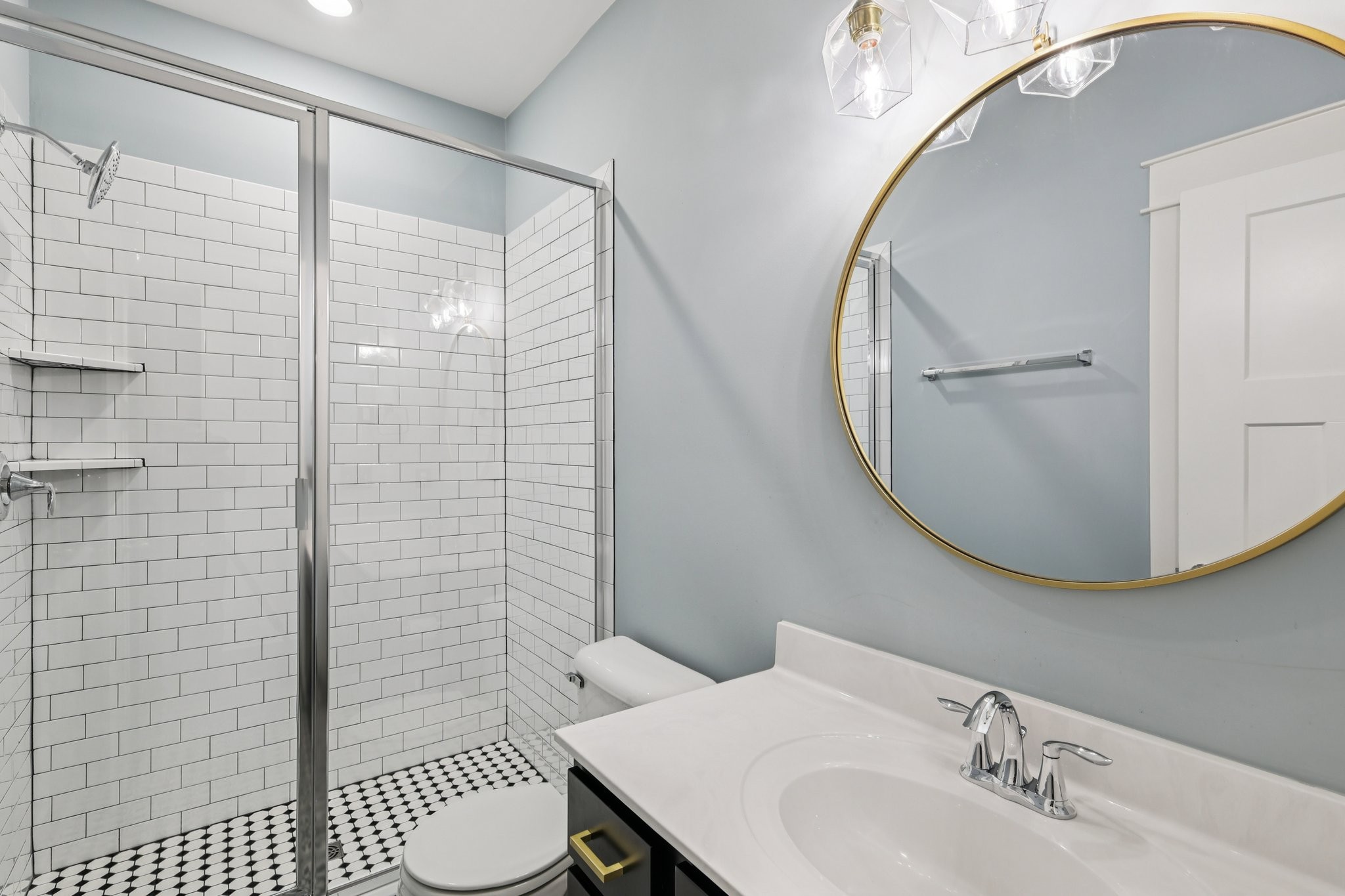 9008 Grayson Circle Mount Juliet, TN 37122 - Photo 16 of 36 a bathroom with a sink toilet and shower