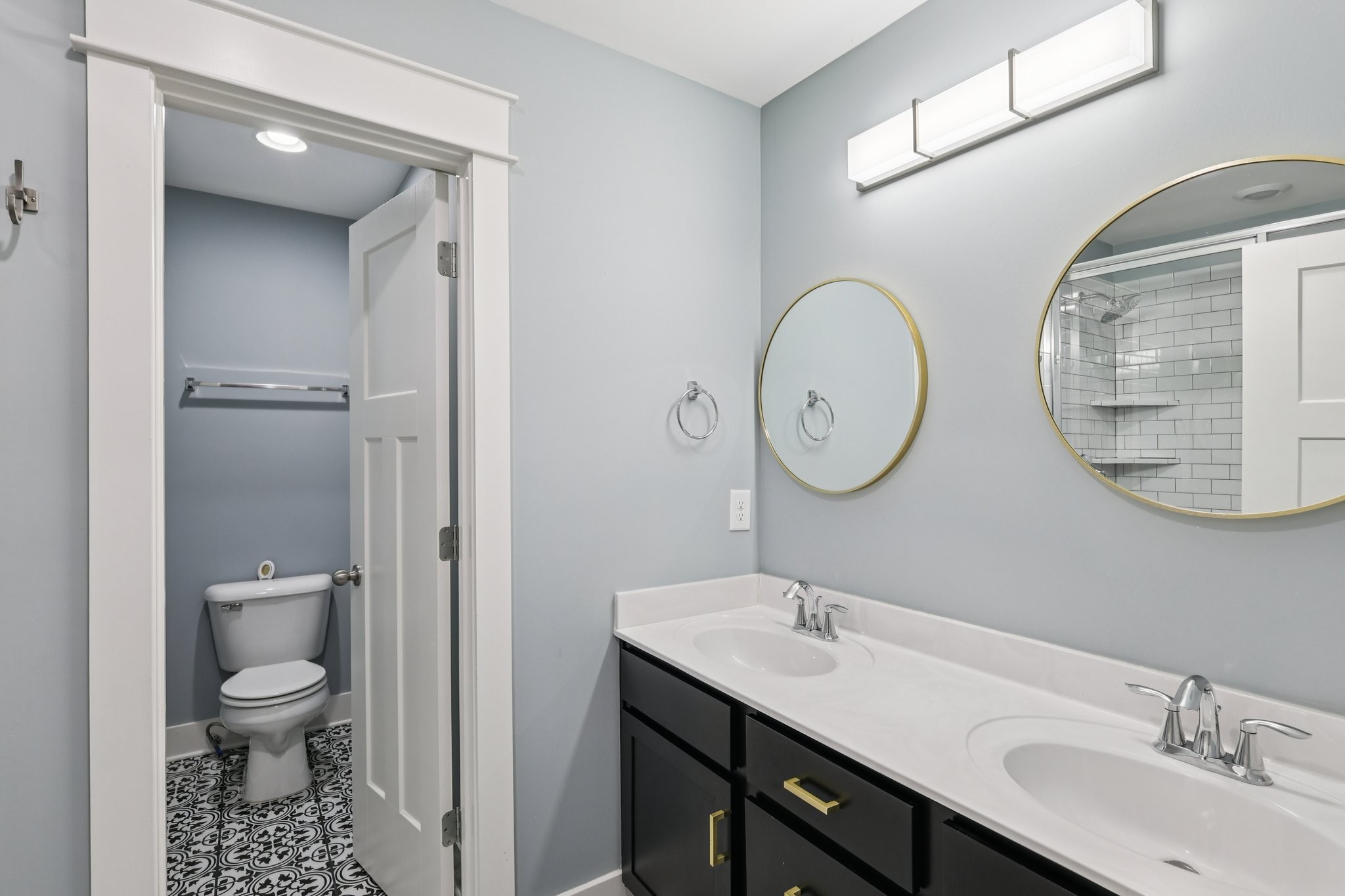 9008 Grayson Circle Mount Juliet, TN 37122 - Photo 28 of 36 a bathroom with a toilet a sink and a mirror