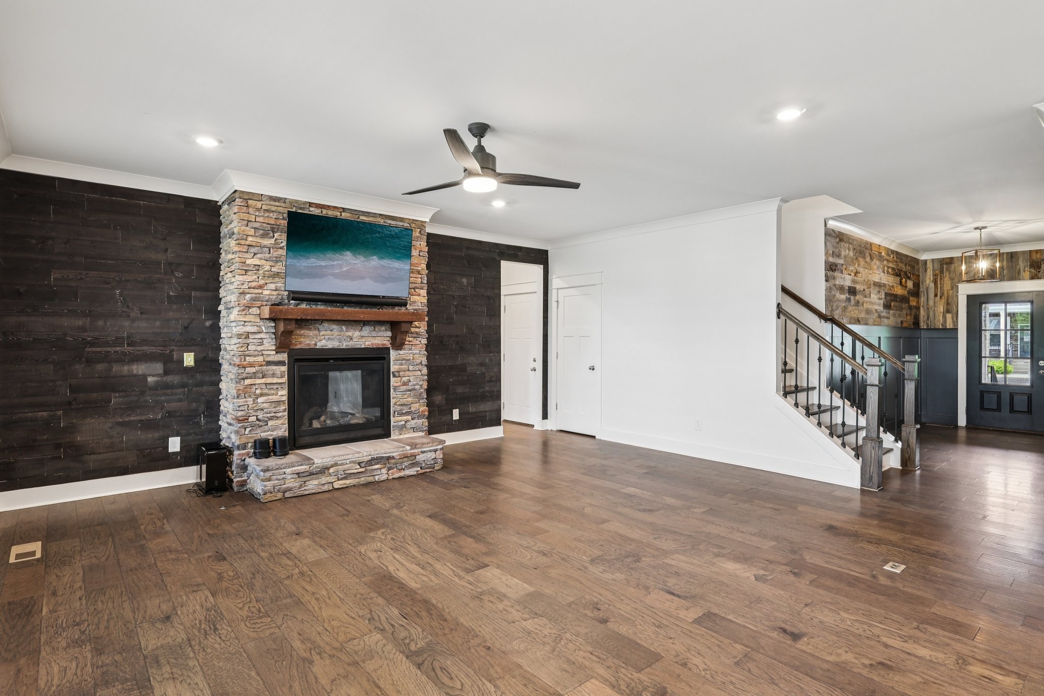 9008 Grayson Circle Mount Juliet, TN 37122 - Photo 6 of 36 a view of an empty room with wooden floor fireplace and a window
