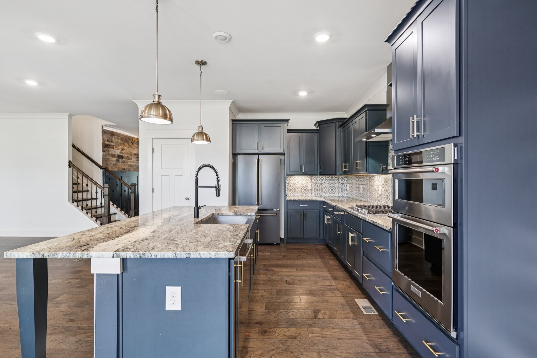 9008 Grayson Circle Mount Juliet, TN 37122 - Photo 10 of 36 a large kitchen with stainless steel appliances granite countertop a sink a stove and a refrigerator