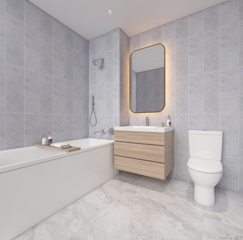 133-25 37th Avenue, Unit 3A Queens, NY 11354 - Photo 6 of 11 Bathroom featuring tile walls, vanity, marble finish flooring, shower / bathtub combination, and recessed lighting