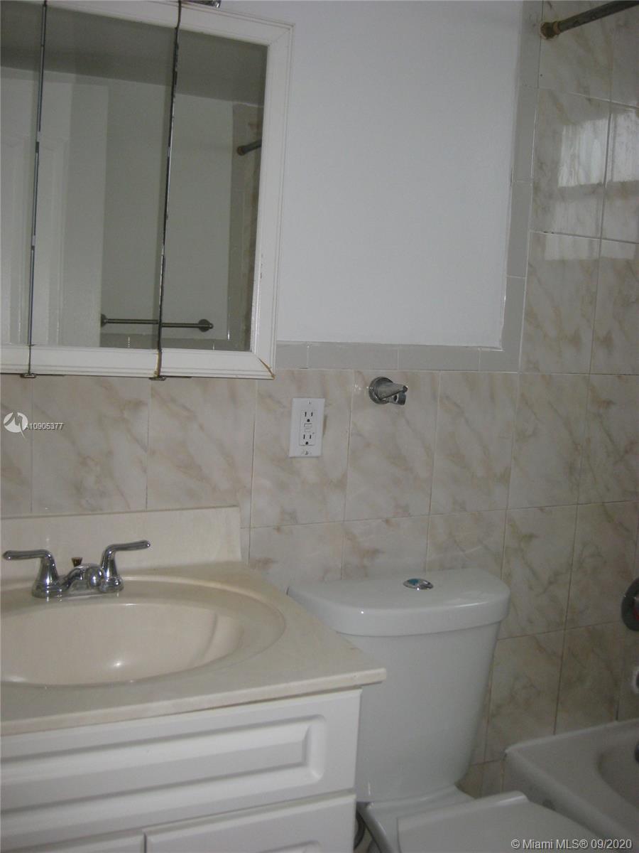 11 Southwest 32nd Avenue, Unit 1 Miami, FL 33135 - Photo 11 of 14 a bathroom with a sink and a toilet