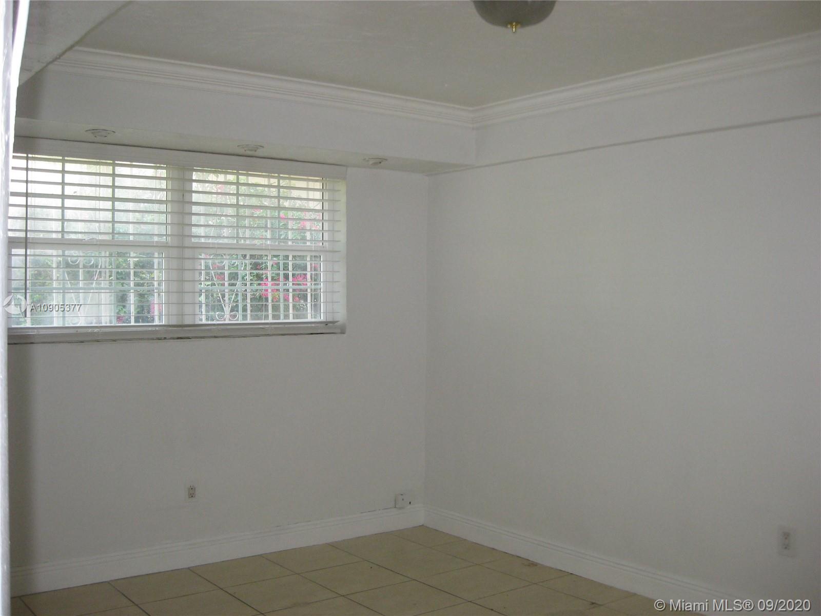 11 Southwest 32nd Avenue, Unit 1 Miami, FL 33135 - Photo 12 of 14 a bathroom with a window