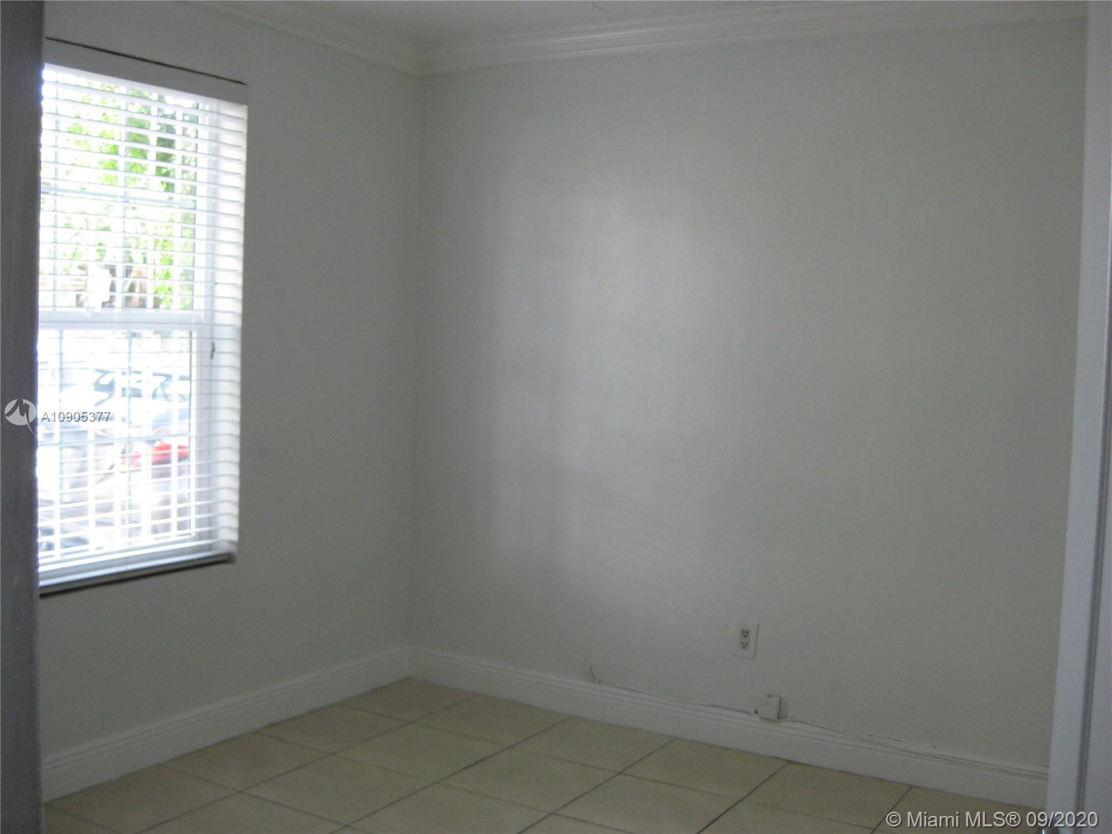 11 Southwest 32nd Avenue, Unit 1 Miami, FL 33135 - Photo 13 of 14 an empty room with a window