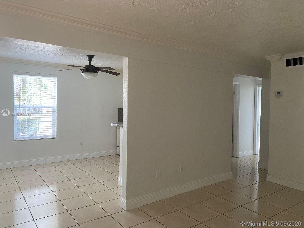 11 Southwest 32nd Avenue, Unit 1 Miami, FL 33135 - Photo 2 of 14 a view of an empty room and window