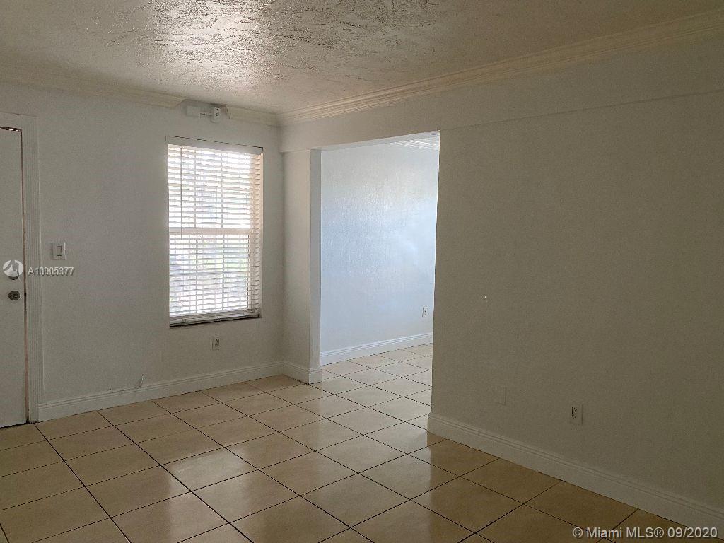11 Southwest 32nd Avenue, Unit 1 Miami, FL 33135 - Photo 8 of 14 an empty room with windows