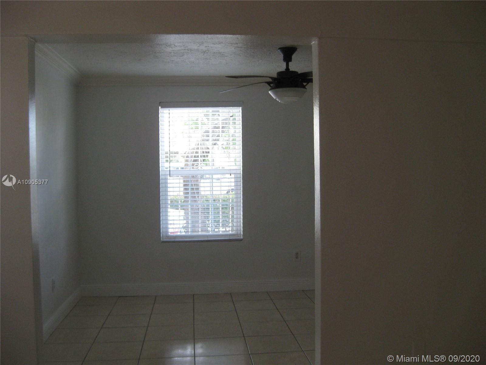 11 Southwest 32nd Avenue, Unit 1 Miami, FL 33135 - Photo 9 of 14 a view of an empty room and a window