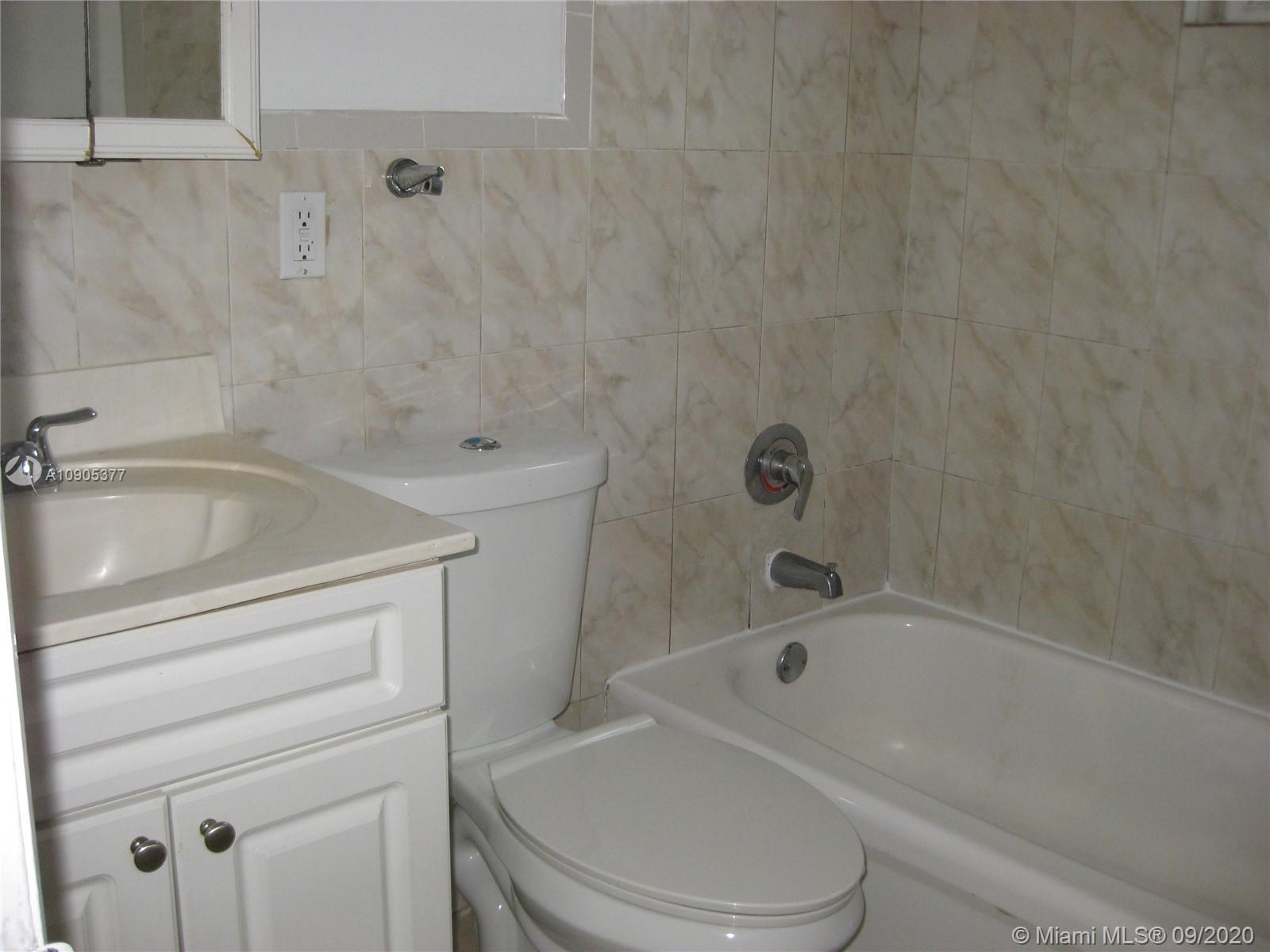 11 Southwest 32nd Avenue, Unit 1 Miami, FL 33135 - Photo 10 of 14 a bathroom with a toilet and a bathtub