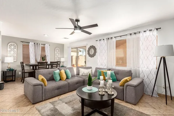 a living room with furniture and a large window