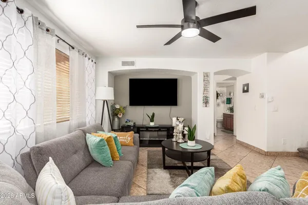 a living room with furniture and a flat screen tv