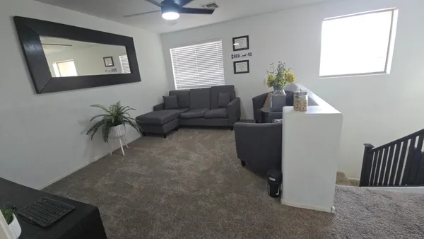 a living room with furniture and a window