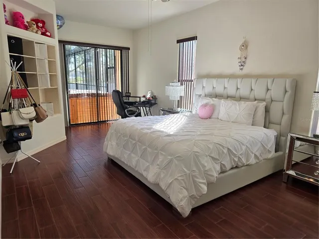 a living room with furniture and a floor to ceiling window