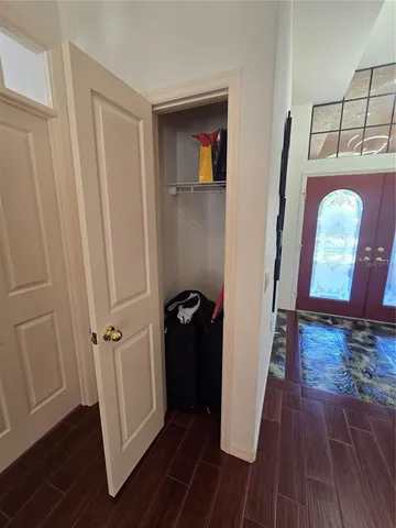 a large kitchen with a table and chairs