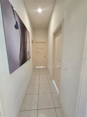 a bathroom with a granite countertop sink a mirror and a shower