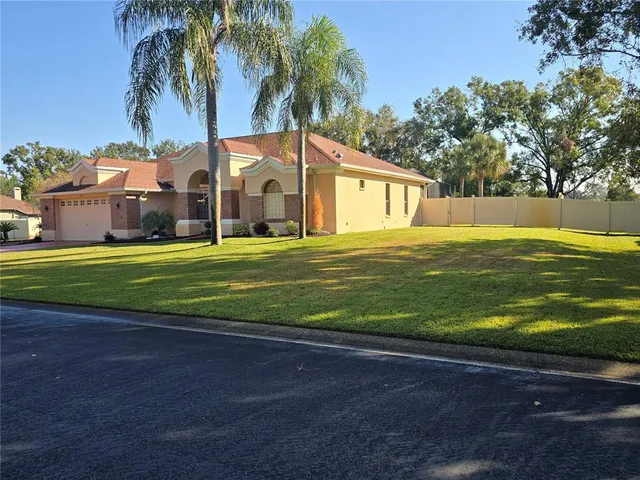 a view of a house with a big yard