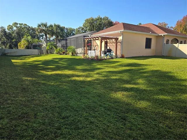 a view of a back yard of a house
