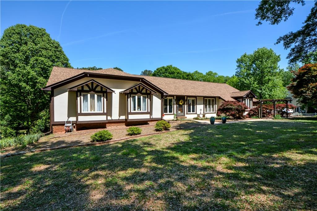 130 Hawn Road Fayetteville, GA 30215 - Photo 59 of 67 a front view of a house with garden