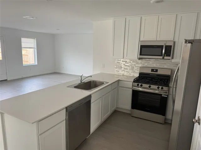 an empty room with a empty space and a window