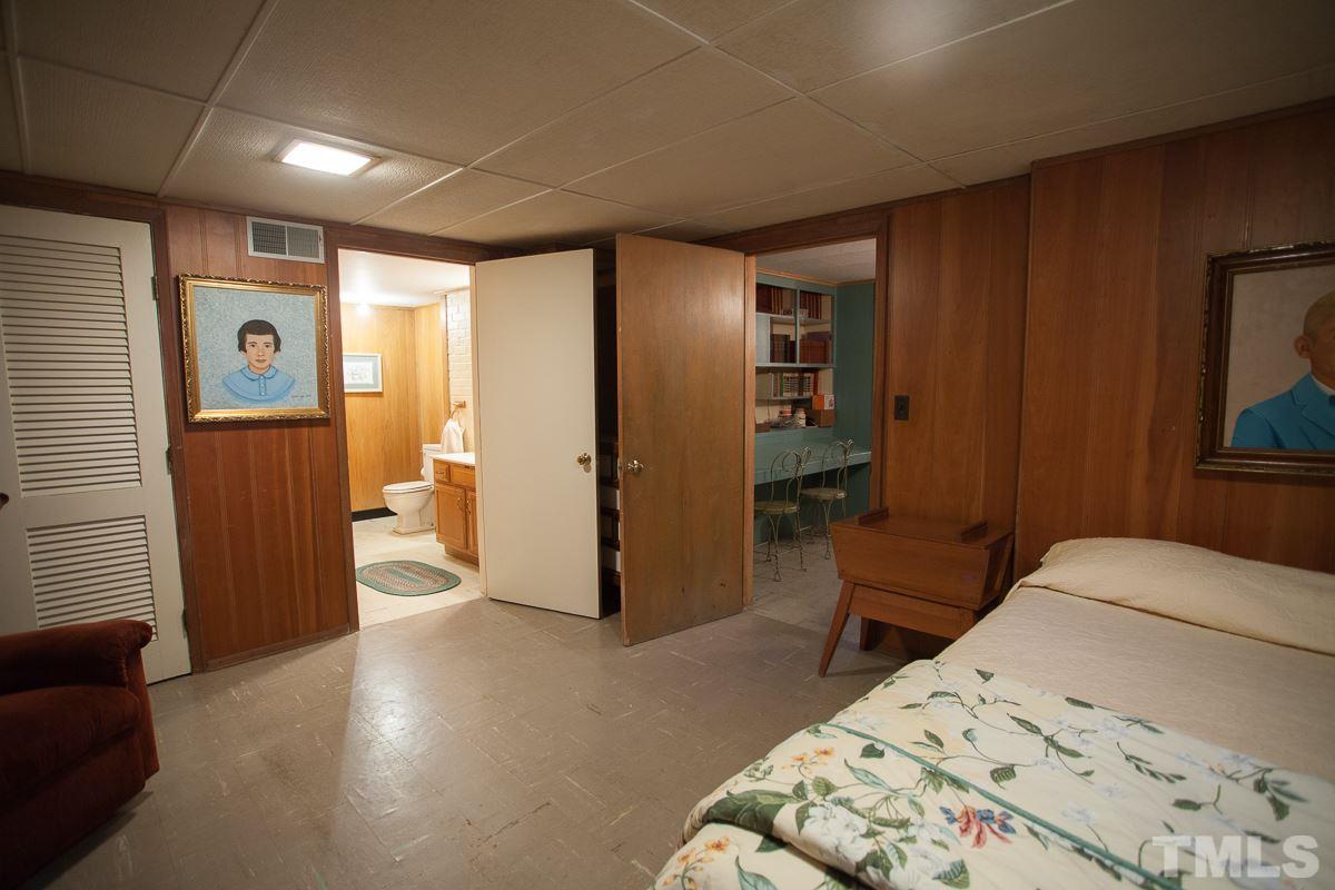 245 Weldon Wrenn Road Roxboro, NC 27574 - Photo 2 of 25 a bedroom with a bed and a couch