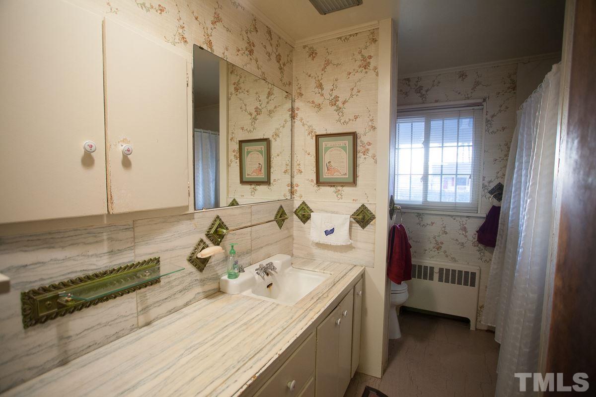 245 Weldon Wrenn Road Roxboro, NC 27574 - Photo 11 of 25 a bathroom with double vanity and two mirrors