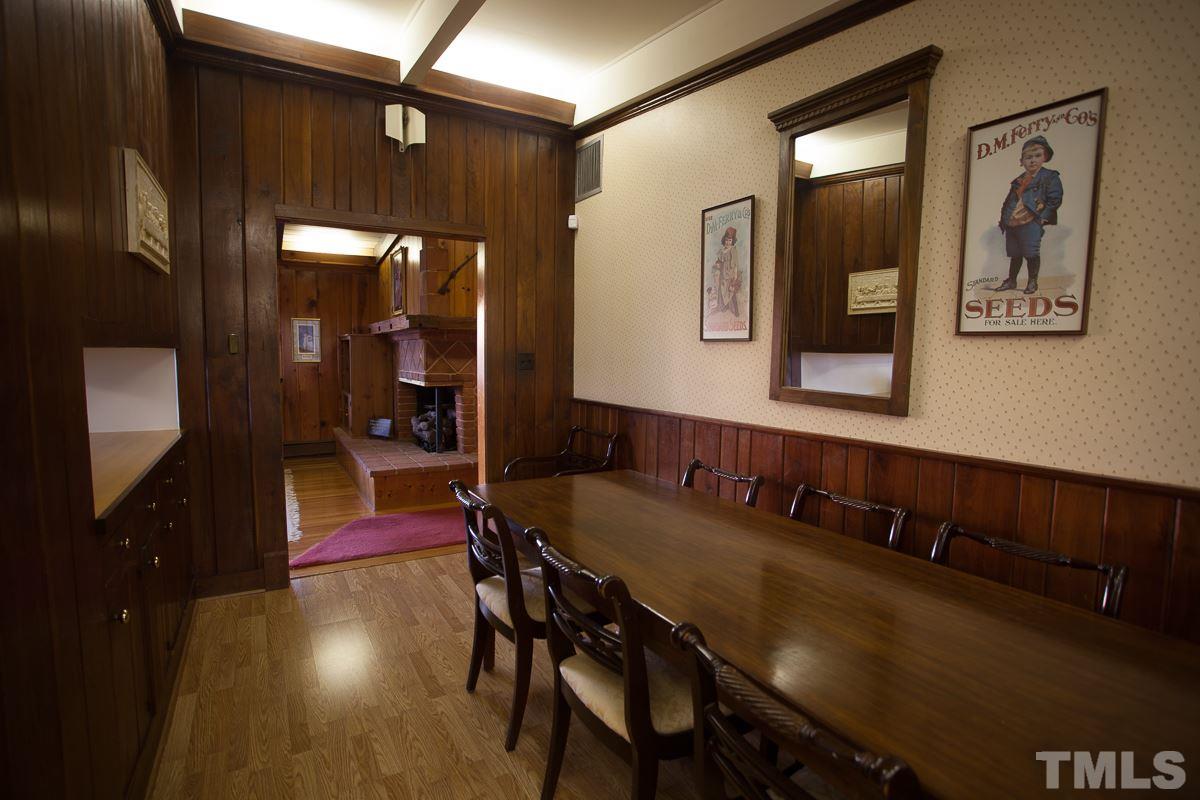 245 Weldon Wrenn Road Roxboro, NC 27574 - Photo 16 of 25 a view of a dining room with furniture and wooden floor