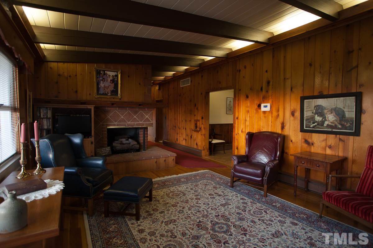 245 Weldon Wrenn Road Roxboro, NC 27574 - Photo 21 of 25 a living room with furniture and a fireplace