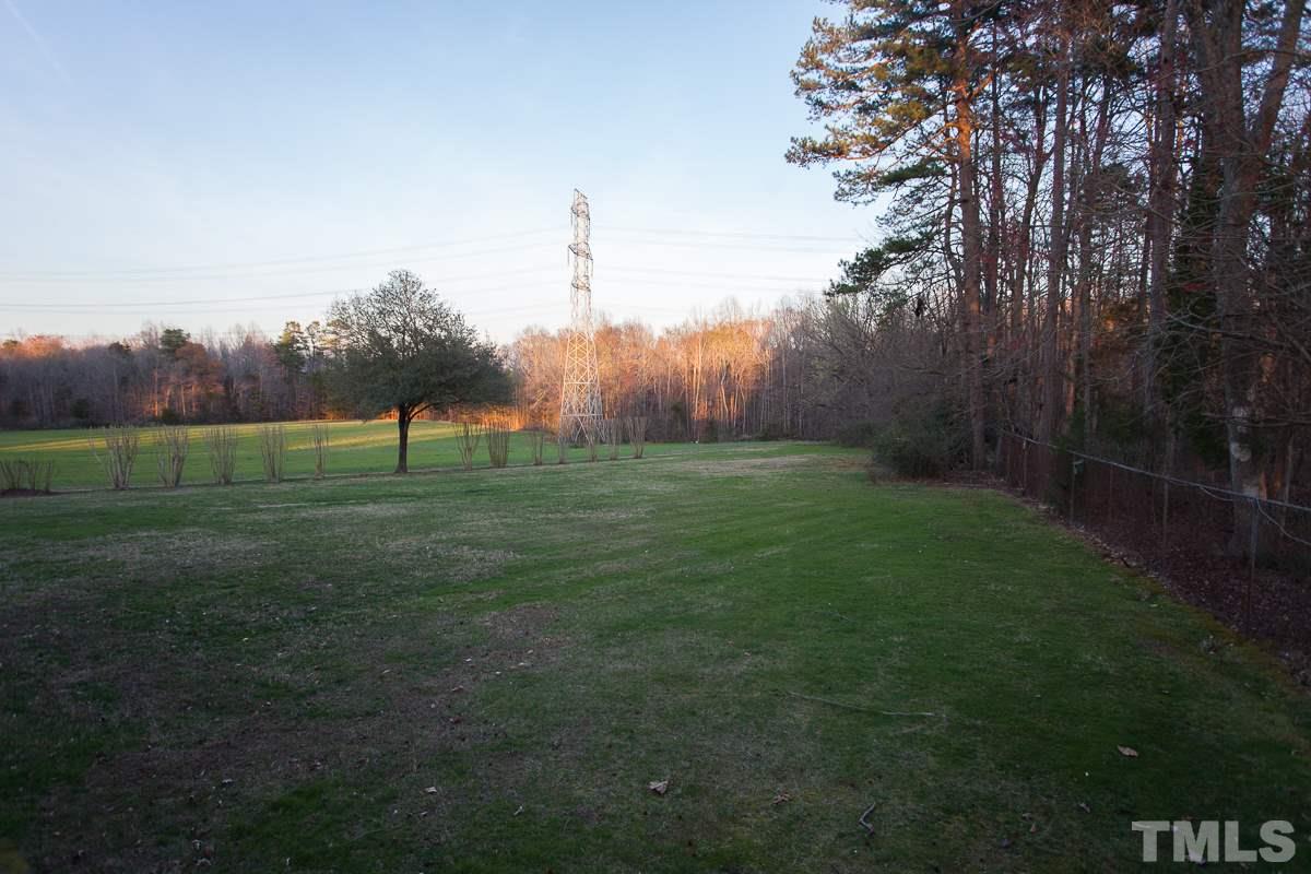 245 Weldon Wrenn Road Roxboro, NC 27574 - Photo 25 of 25 a view of grassy field with trees