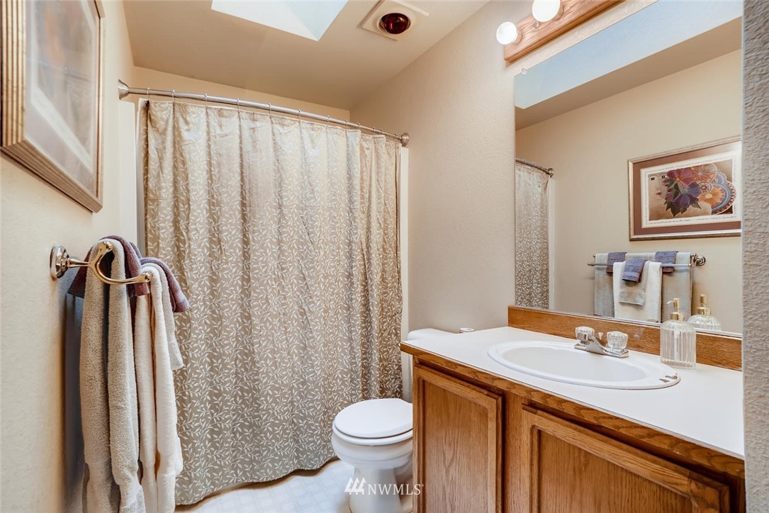 2008 238th Street Southeast Bothell, WA 98021 - Photo 22 of 25 a bathroom with a sink toilet and shower
