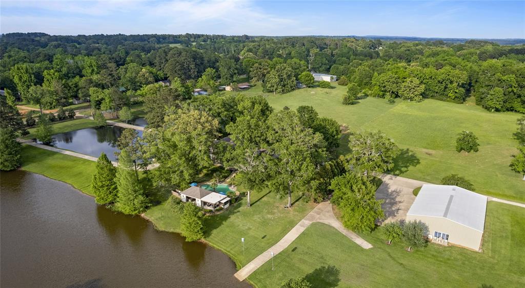 3920 Smelley Road Longview, TX 75605 - Photo 33 of 35 a view of a lake with a yard