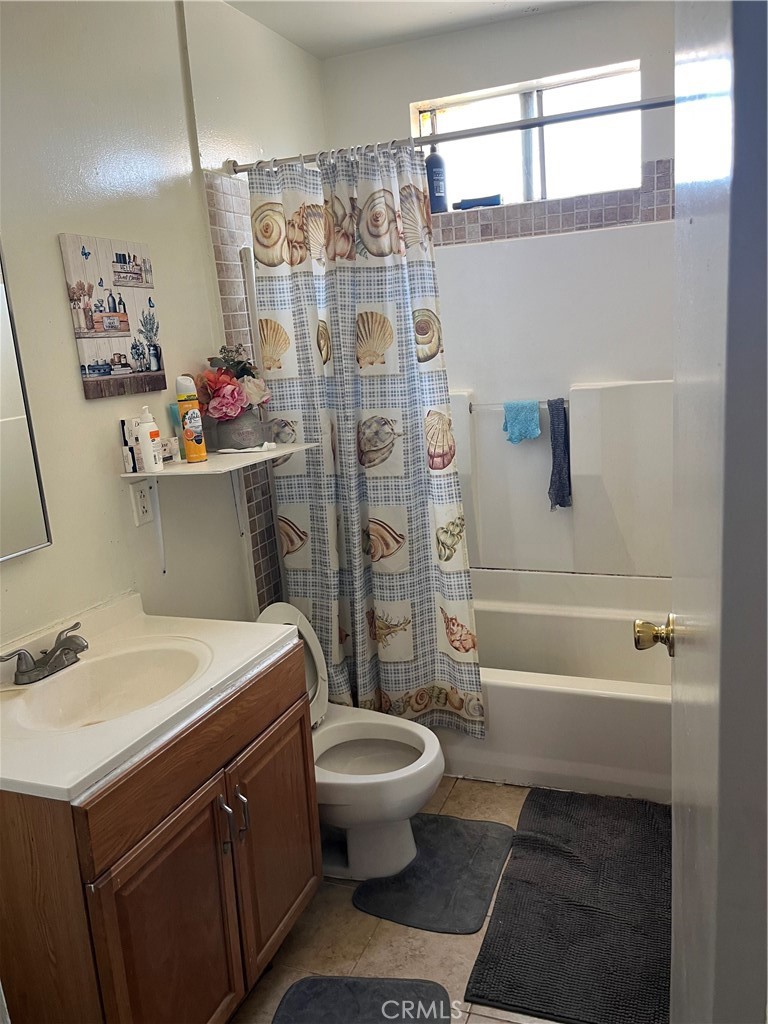 201 West Raymond Street Compton, CA 90220 - Photo 18 of 19 a bathroom with a sink toilet and shower