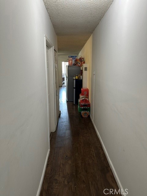 201 West Raymond Street Compton, CA 90220 - Photo 6 of 19 a view of a hallway with wooden staircase