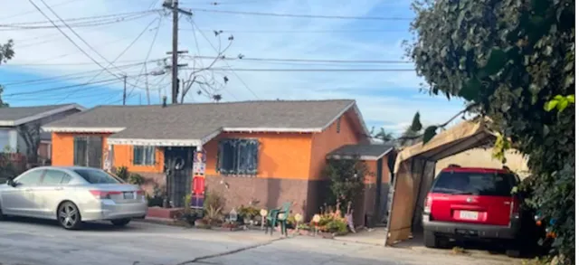 a car parked in front of a house
