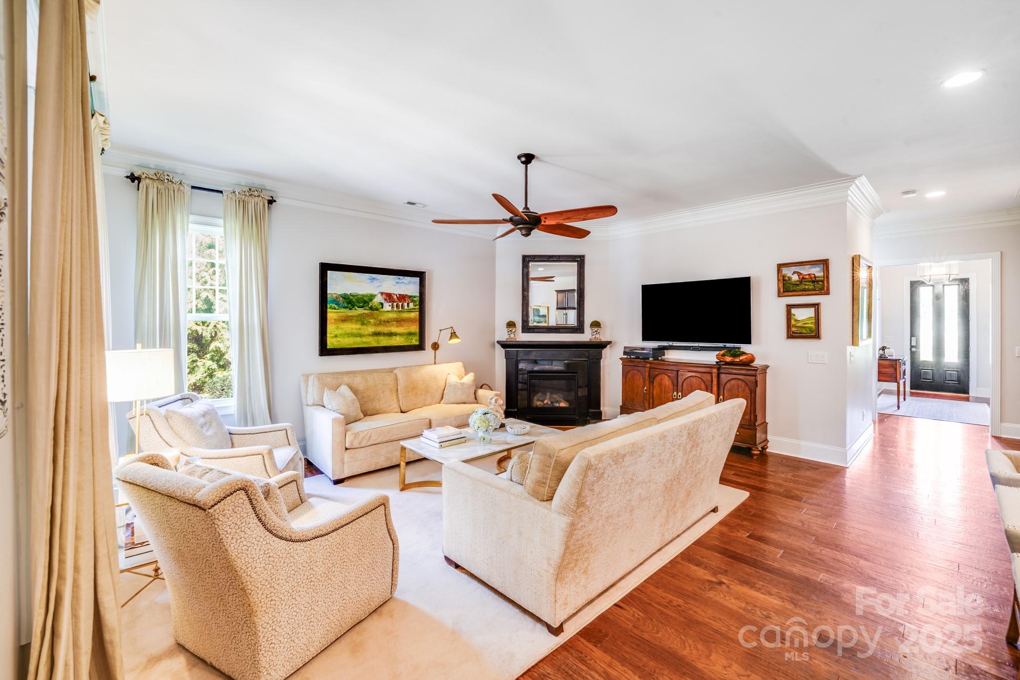 2702 Arsdale Road Waxhaw, NC 28173 - Photo 18 of 48 a living room with fireplace furniture and a flat screen tv