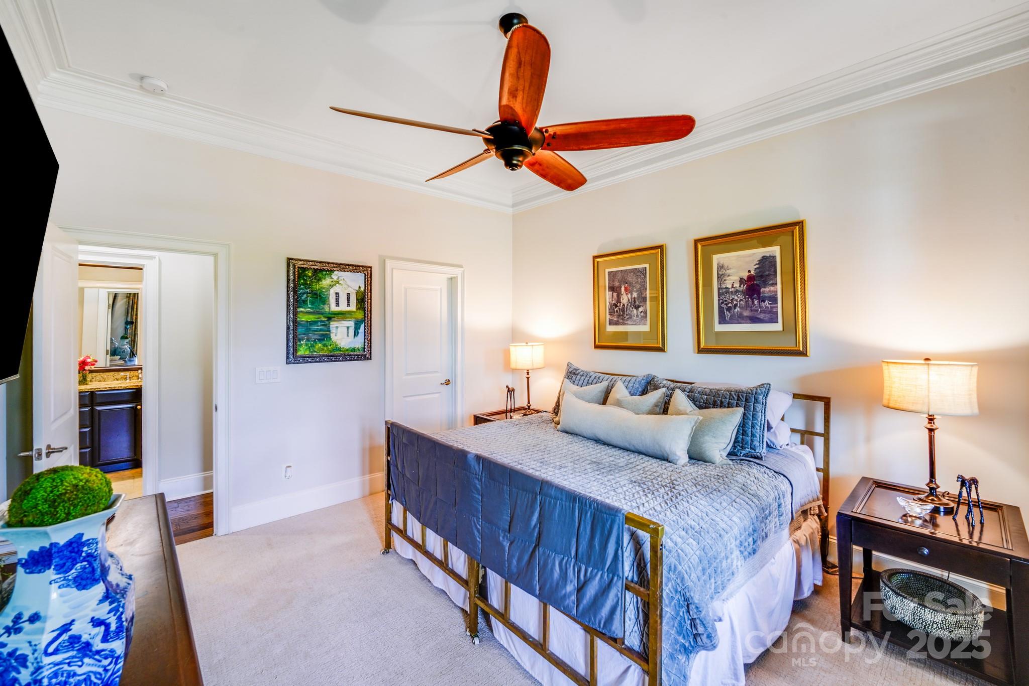 2702 Arsdale Road Waxhaw, NC 28173 - Photo 19 of 48 a bedroom with a bed a window and a chandelier