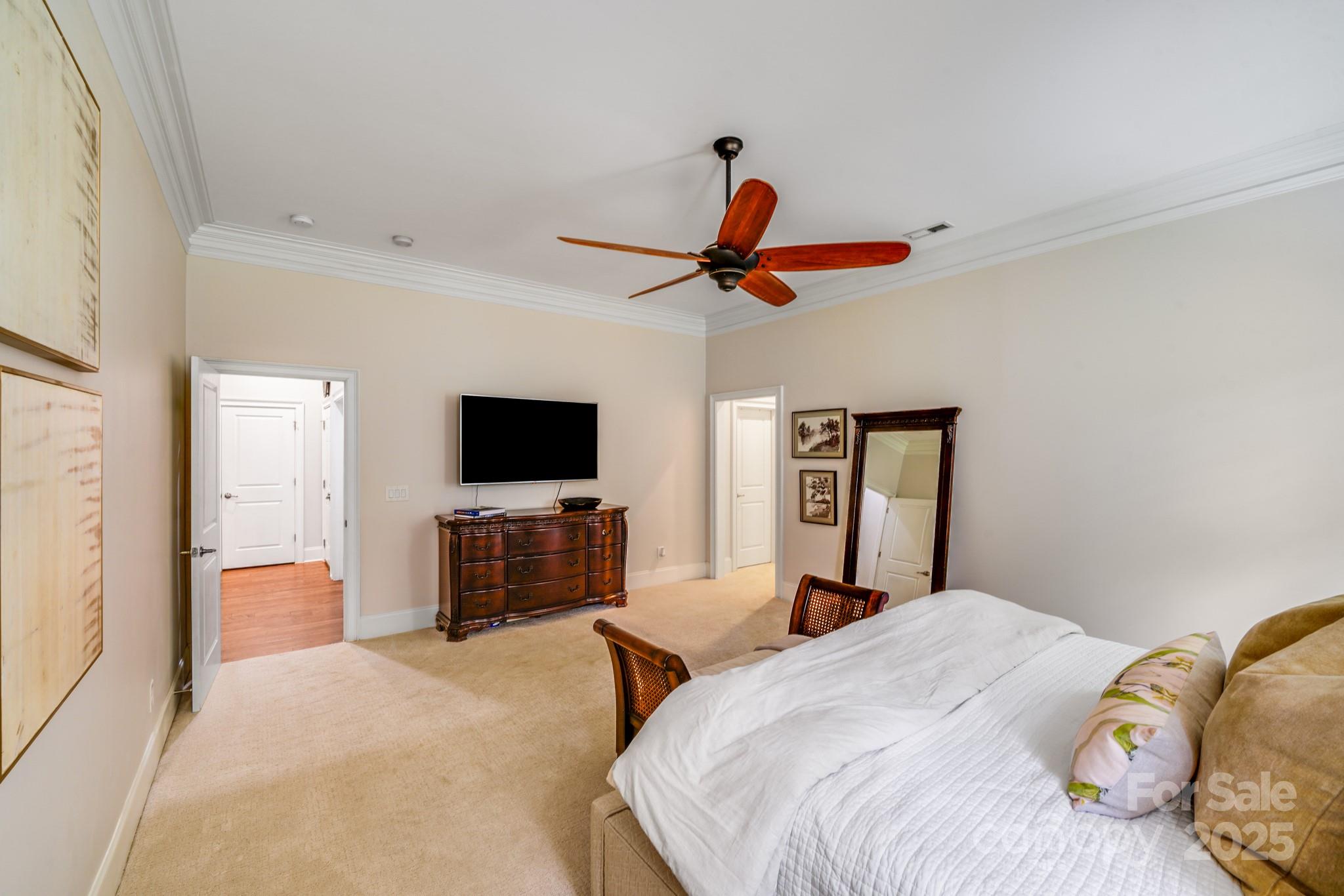 2702 Arsdale Road Waxhaw, NC 28173 - Photo 27 of 48 a bedroom with a bed and a flat screen tv