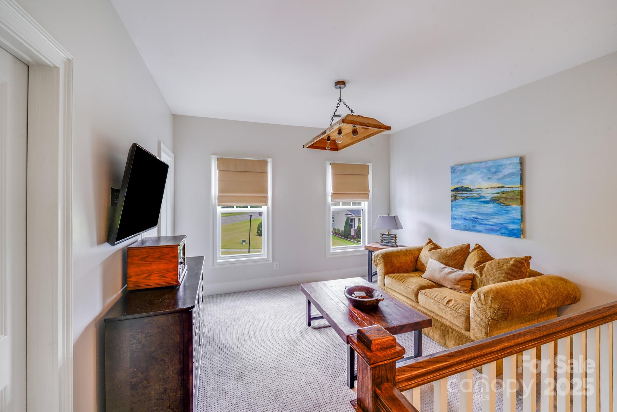 2702 Arsdale Road Waxhaw, NC 28173 - Photo 33 of 48 a living room with furniture and a flat screen tv