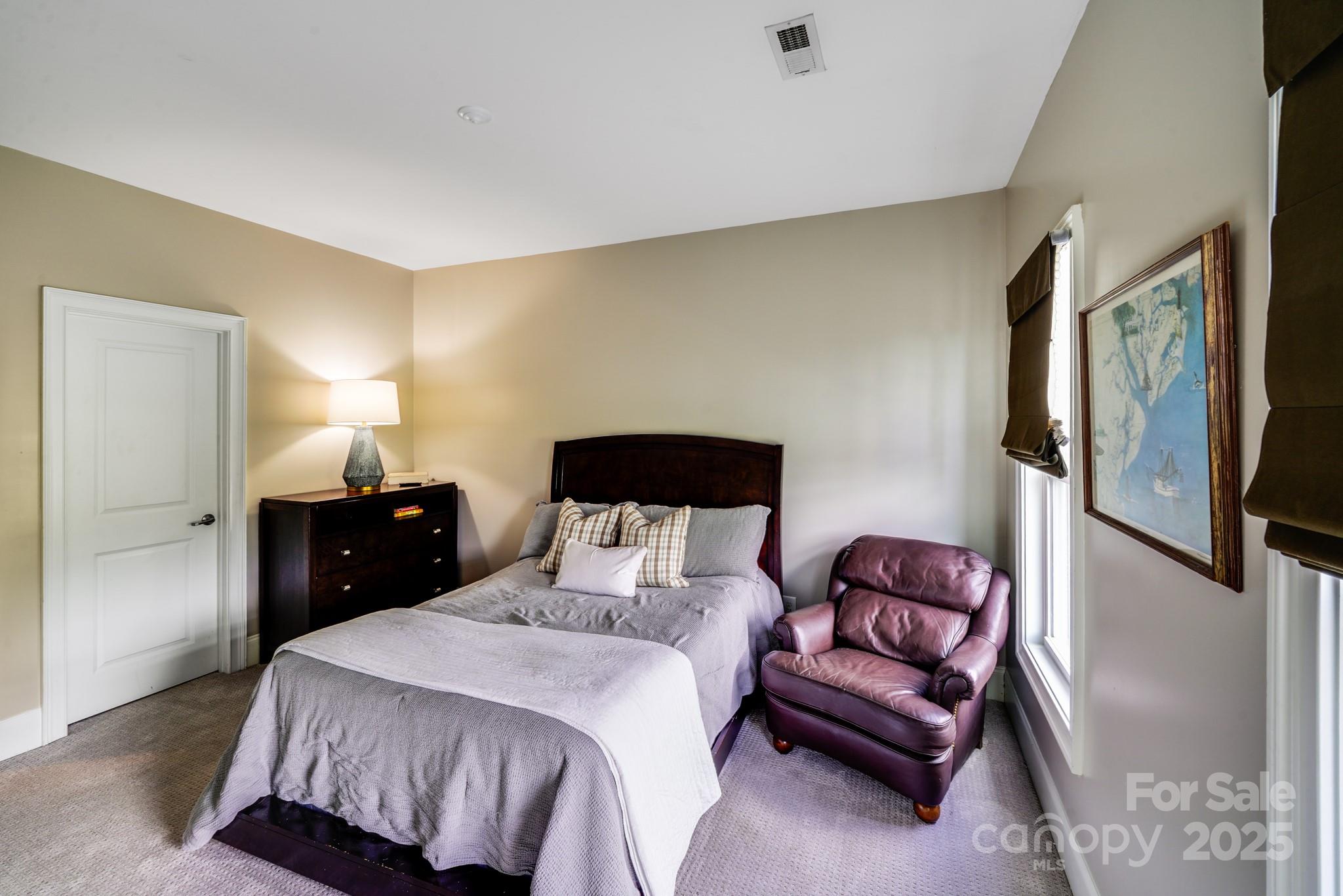 2702 Arsdale Road Waxhaw, NC 28173 - Photo 37 of 48 a bedroom with a bed and a walk in closet