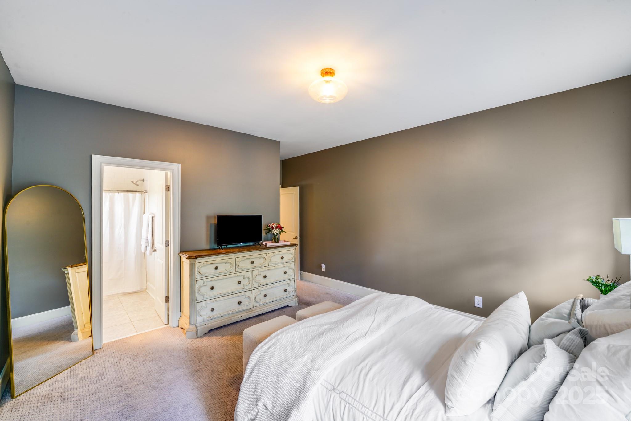 2702 Arsdale Road Waxhaw, NC 28173 - Photo 40 of 48 a bedroom with a bed and a television